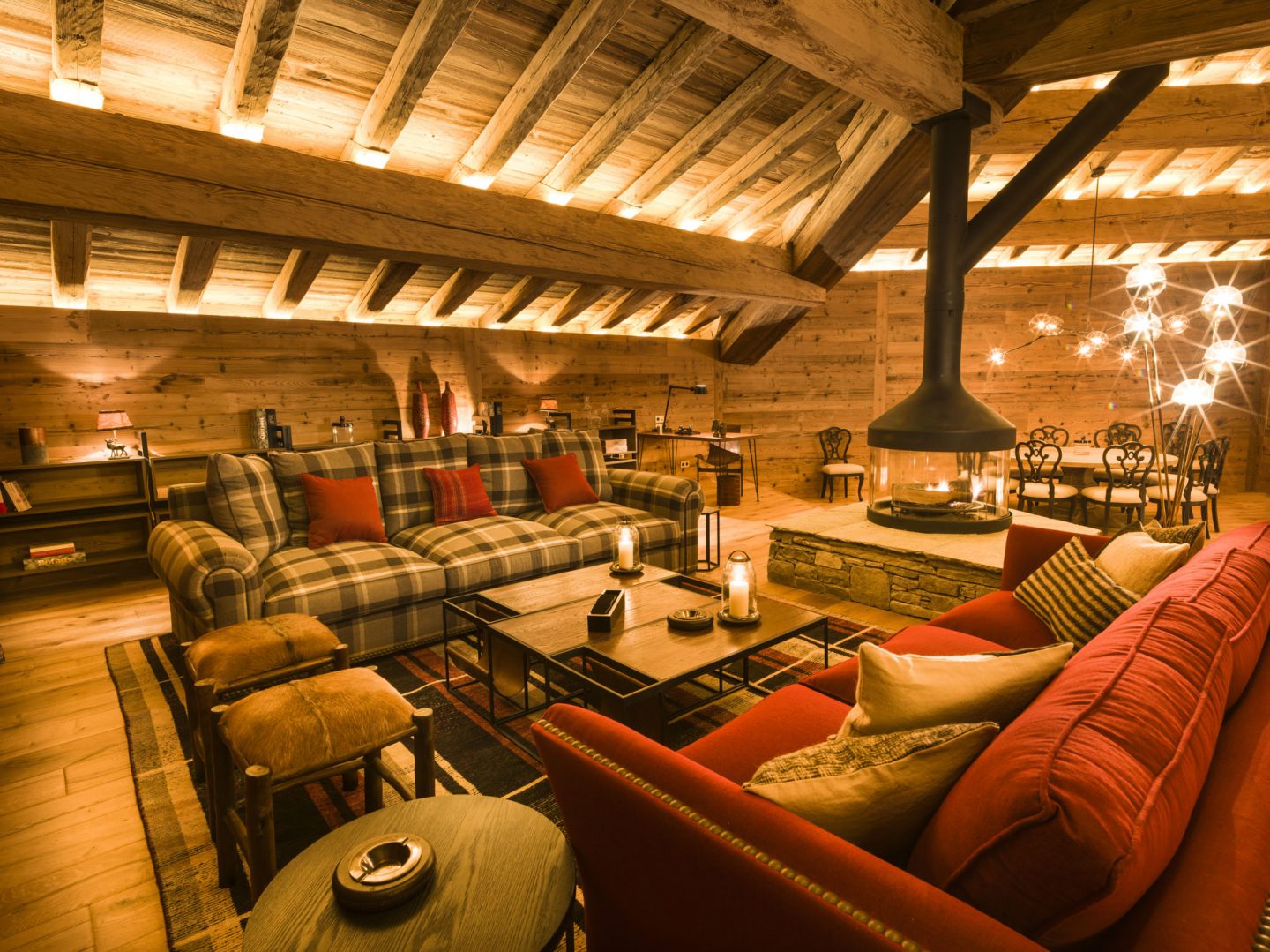 Large sofas and fireplace in romantic French chalet