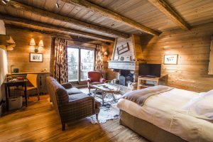 Wooden and cosy bedroom in French ski chalet, Hotel Le Blizzard.