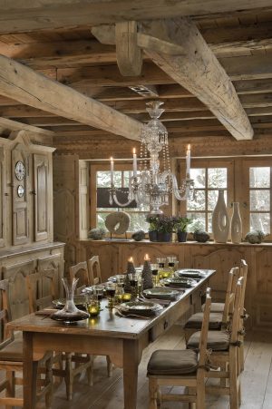 Romantic dining table and chandelier at Les Fermes de Marie ski chalet.