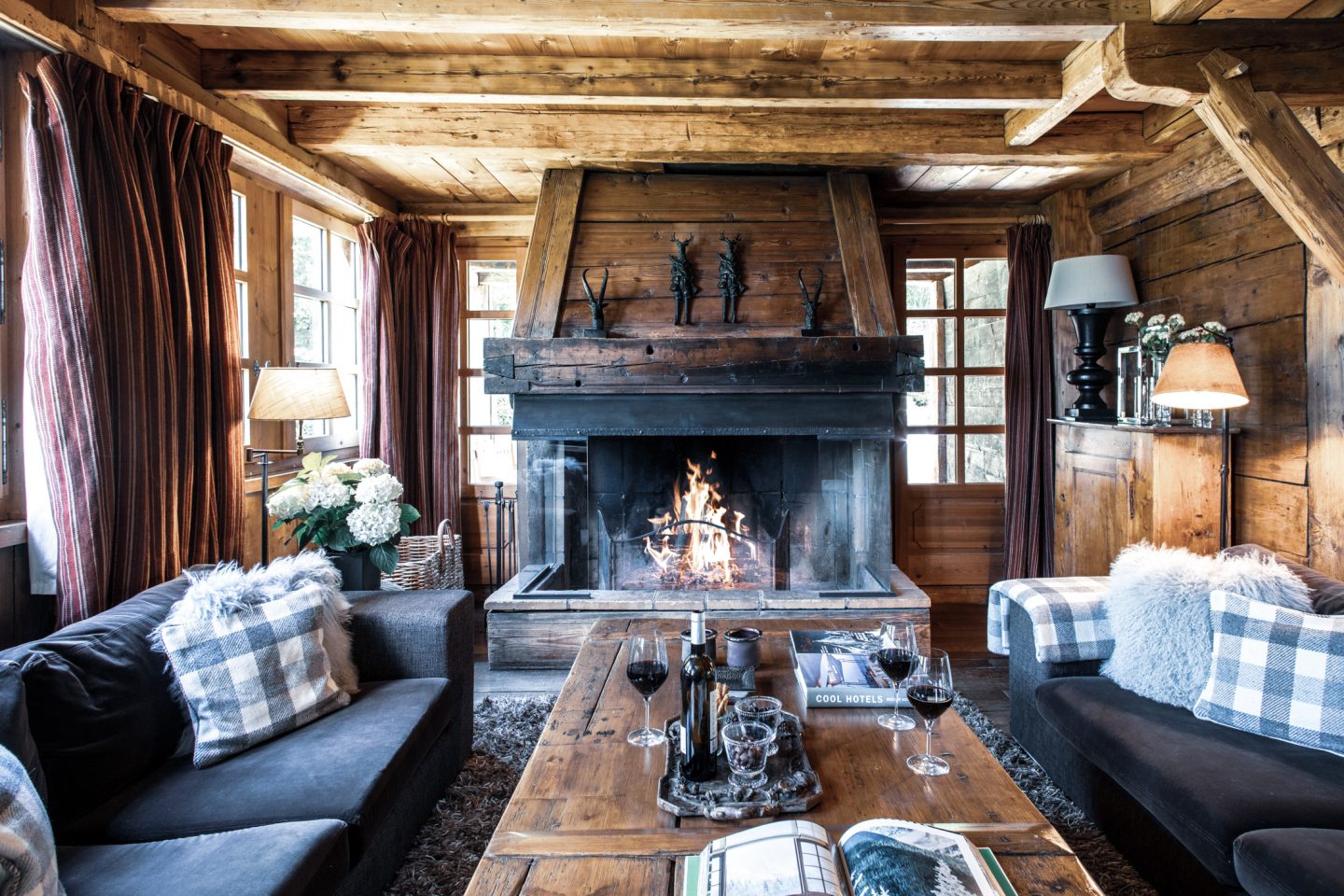 Fireplace and red wine in romantic French ski chalet.